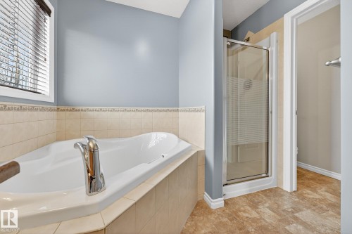 Full bath with a stall shower and a bath - 152 Rue Marquet, Beaumont, AB - Indoor Photo Showing Bathroom