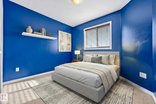 Bedroom featuring light carpet and baseboards - 152 Rue Marquet, Beaumont, AB - Indoor Photo Showing Bedroom
