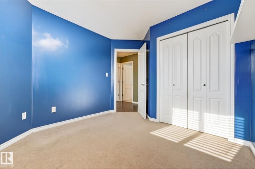 Unfurnished bedroom featuring light colored carpet and a closet - 152 Rue Marquet, Beaumont, AB - Indoor