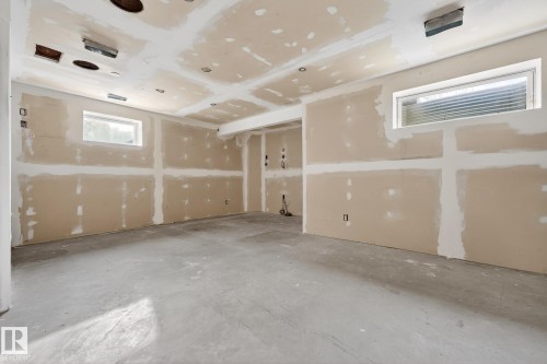 Empty room with unfinished concrete flooring - 152 Rue Marquet, Beaumont, AB - Indoor Photo Showing Garage