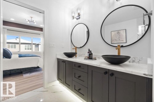 Bathroom with double vanity, light marble finish flooring, ensuite bath, and recessed lighting - 3722 41 Avenue, Beaumont, AB - Indoor Photo Showing Bathroom