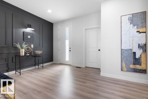 Foyer featuring light wood-type flooring - 3722 41 Avenue, Beaumont, AB - Indoor Photo Showing Other Room