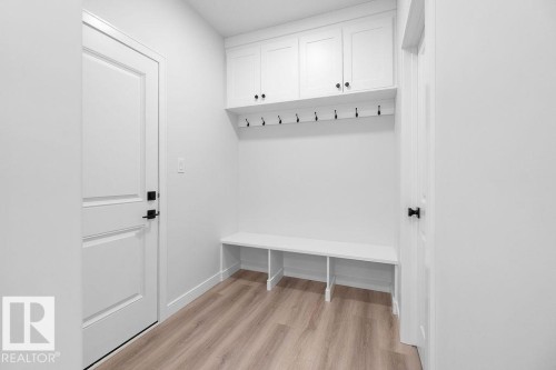 Mudroom featuring light wood finished floors and baseboards - 3722 41 Avenue, Beaumont, AB - Indoor Photo Showing Other Room