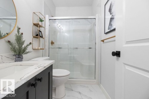 Full bathroom with vanity, a stall shower, and light marble finish flooring - 3722 41 Avenue, Beaumont, AB - Indoor Photo Showing Bathroom