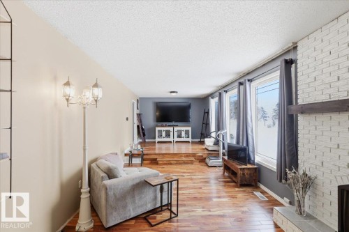 189 Elm Crescent, Wetaskiwin, AB - Indoor Photo Showing Living Room With Fireplace