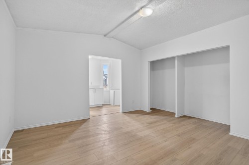 Unfurnished bedroom with light wood-style floors and a closet - 72 Evergreen Park, Edmonton, AB - Indoor Photo Showing Other Room
