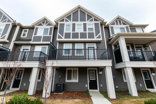 View of front of home with a balcony - 105 2072 Wonnacott Way, Edmonton, AB - Outdoor With Facade