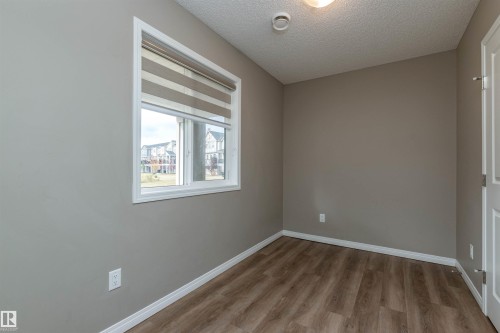 Den/Flex room - 105 2072 Wonnacott Way, Edmonton, AB - Indoor Photo Showing Other Room