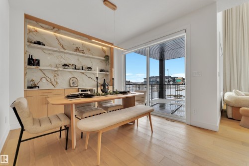 Dining space featuring light wood finished floors - 2408 1 Ave Sw, Edmonton, AB - Indoor Photo Showing Other Room