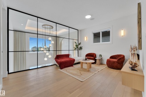 Building lobby with a tray ceiling and floor to ceiling windows - 2408 1 Ave Sw, Edmonton, AB - Indoor Photo Showing Other Room