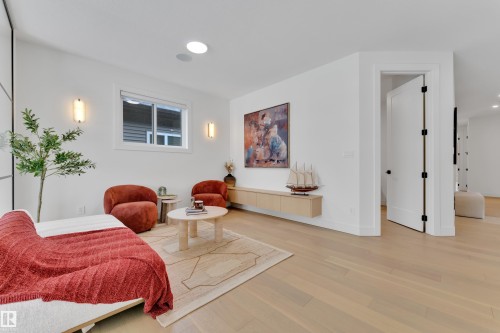 Bedroom featuring light wood-style floors and recessed lighting - 2408 1 Ave Sw, Edmonton, AB - Indoor