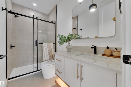 Full bath with vanity and a shower stall - 2408 1 Ave Sw, Edmonton, AB - Indoor Photo Showing Bathroom
