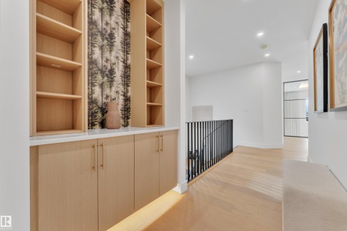 Hall with light wood finished floors and recessed lighting - 2408 1 Ave Sw, Edmonton, AB - Indoor Photo Showing Other Room