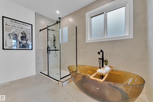 Bathroom featuring a soaking tub, a shower stall, plenty of natural light, and recessed lighting - 2408 1 Ave Sw, Edmonton, AB - Indoor