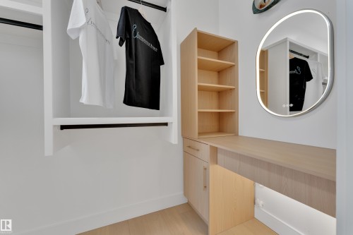 Walk in closet featuring light wood finished floors - 2408 1 Ave Sw, Edmonton, AB - Indoor Photo Showing Other Room