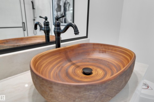 Bathroom view of a sink and a freestanding tub - 2408 1 Ave Sw, Edmonton, AB - Indoor Photo Showing Other Room