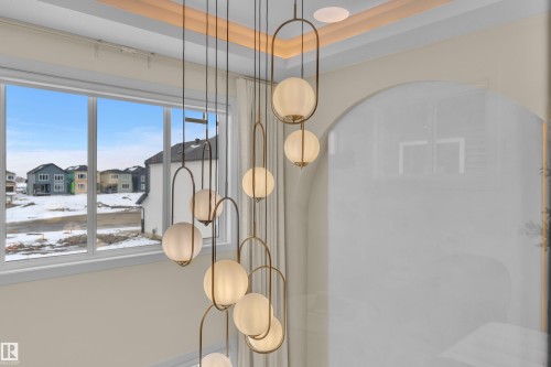 Detailed view of a raised ceiling and a residential view - 2408 1 Ave Sw, Edmonton, AB - Indoor