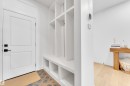 Mudroom featuring light wood-style floors and baseboards - 2408 1 Ave Sw, Edmonton, AB  - Indoor 