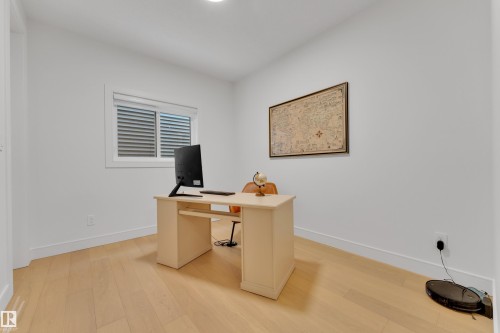 Office area featuring light wood-style floors and baseboards - 2408 1 Ave Sw, Edmonton, AB - Indoor Photo Showing Office