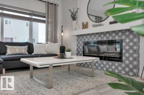 104 Bluff Cove, Leduc, AB - Indoor Photo Showing Living Room With Fireplace