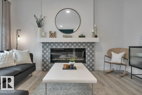 104 Bluff Cove, Leduc, AB - Indoor Photo Showing Living Room With Fireplace