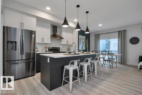 104 Bluff Cove, Leduc, AB - Indoor Photo Showing Kitchen With Upgraded Kitchen