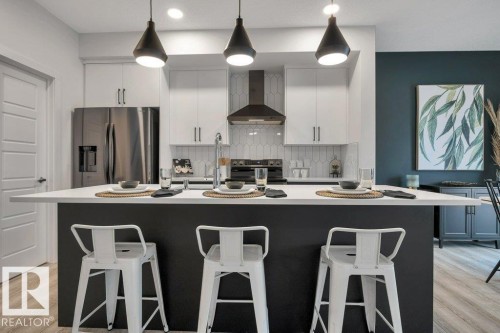 104 Bluff Cove, Leduc, AB - Indoor Photo Showing Kitchen With Upgraded Kitchen