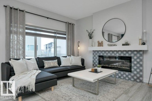 104 Bluff Cove, Leduc, AB - Indoor Photo Showing Living Room With Fireplace