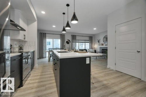 104 Bluff Cove, Leduc, AB - Indoor Photo Showing Kitchen With Upgraded Kitchen