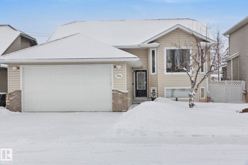 Tri-level home featuring brick siding and an attached garage - 103 Adams Close, Red Deer, AB - Outdoor