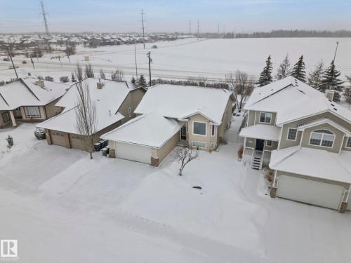 Aerial perspective of suburban area - 103 Adams Close, Red Deer, AB - Outdoor With View