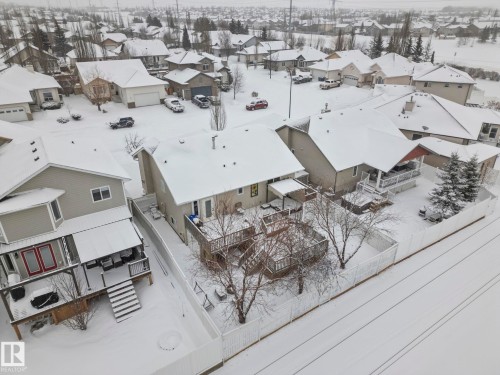 Snowy aerial view featuring a residential view - 103 Adams Close, Red Deer, AB - Outdoor With View