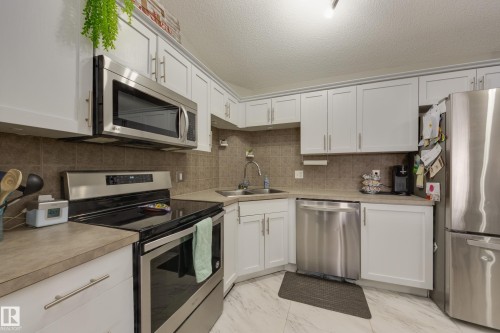 2412 9357 Simpson Drive, Edmonton, AB - Indoor Photo Showing Kitchen With Double Sink