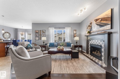 61 Wedgewood Crescent, Fort Saskatchewan, AB - Indoor Photo Showing Living Room With Fireplace