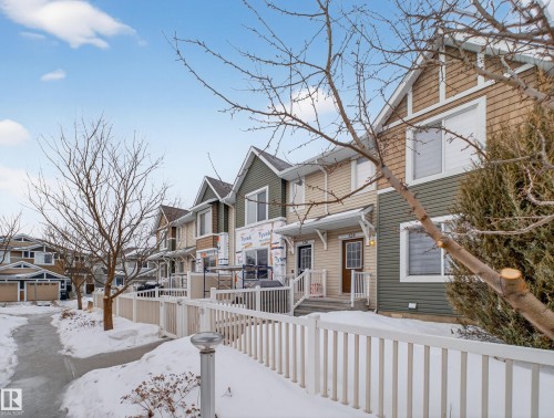 View of front facade with a residential view - 125 655 Tamarack Road, Edmonton, AB - Outdoor With Facade