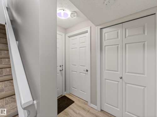 Foyer featuring a textured ceiling and light wood-type flooring - 125 655 Tamarack Road, Edmonton, AB - Indoor Photo Showing Other Room