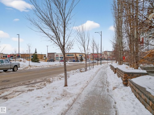 View of asphalt street with street lights - 125 655 Tamarack Road, Edmonton, AB - Outdoor With View