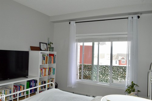 View of bedroom - 437 1818 Rutherford Road, Edmonton, AB - Indoor Photo Showing Bedroom
