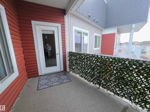 View of exterior entry - 437 1818 Rutherford Road, Edmonton, AB - Outdoor With Exterior