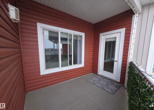 Entrance to property with a patio - 437 1818 Rutherford Road, Edmonton, AB - Outdoor With Exterior