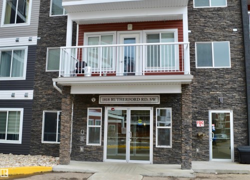 View of building exterior - 437 1818 Rutherford Road, Edmonton, AB - Outdoor With Balcony With Facade
