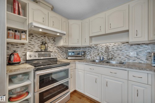 10522 30 Avenue, Edmonton, AB - Indoor Photo Showing Kitchen With Double Sink