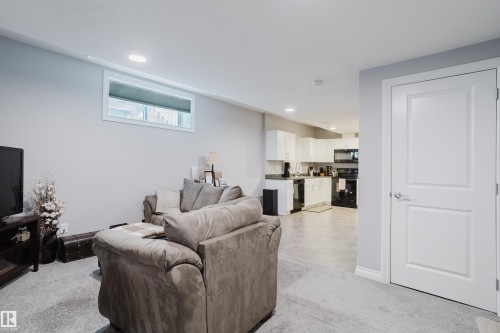 Living room with recessed lighting and light colored carpet - 326 West Haven Drive, Leduc, AB - Indoor Photo Showing Living Room