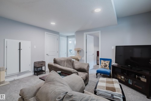 Living room with carpet flooring and recessed lighting - 326 West Haven Drive, Leduc, AB - Indoor Photo Showing Living Room