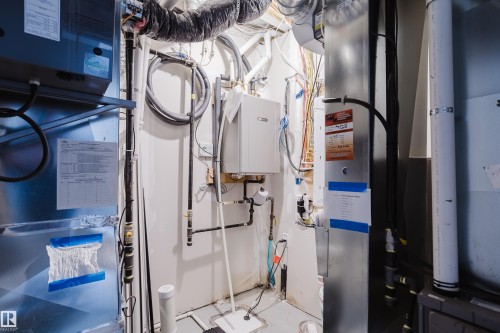 Utilities with heating unit and water heater - 326 West Haven Drive, Leduc, AB - Indoor Photo Showing Basement