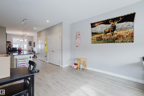 Dining room with light wood-style flooring and a chandelier - 326 West Haven Drive, Leduc, AB - Indoor