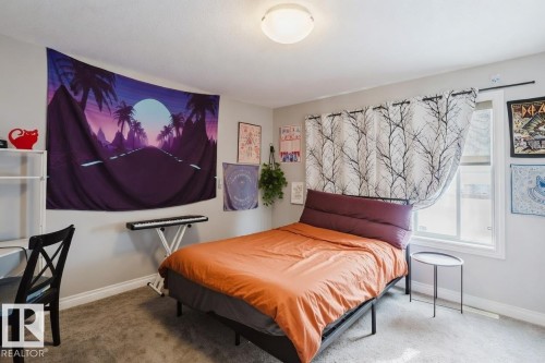 Bedroom with carpet flooring and baseboards - 326 West Haven Drive, Leduc, AB - Indoor Photo Showing Bedroom