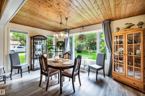Dining space with wood ceiling, suspended lighting, and wood finished floors - 605 6St. Ross Haven, Rural Lac Ste. Anne County, AB - Indoor Photo Showing Dining Room