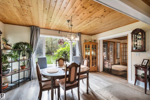 Dining room featuring wood ceiling, hanging lights, and light wood-style flooring - 605 6St. Ross Haven, Rural Lac Ste. Anne County, AB - Indoor Photo Showing Dining Room