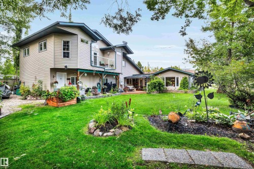 Back of house with a lawn and a deck - 605 6St. Ross Haven, Rural Lac Ste. Anne County, AB - Outdoor